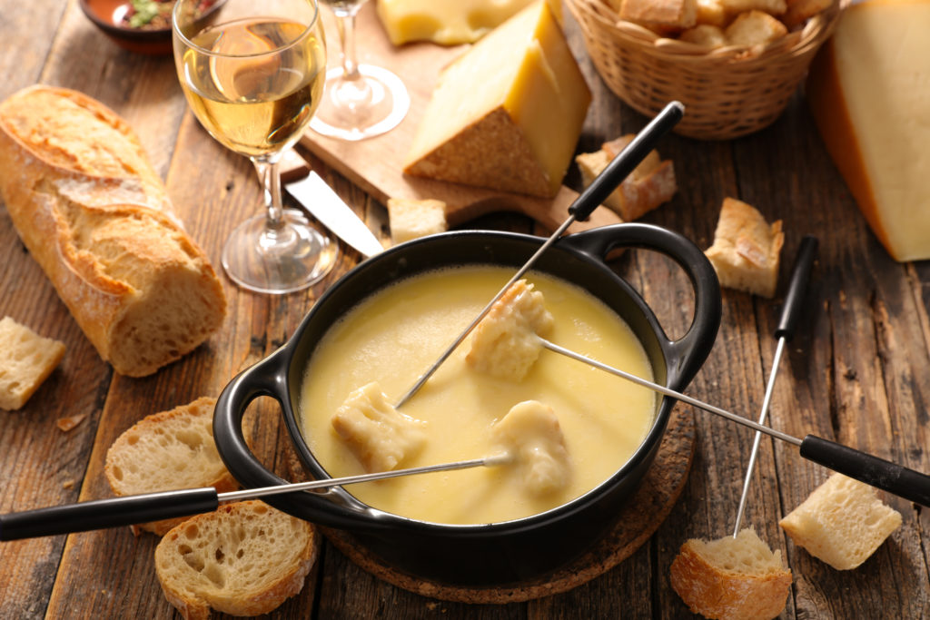 fondue suisse moitié-moitié emmental et gruyère impact tarifs douaniers américains marche suisse